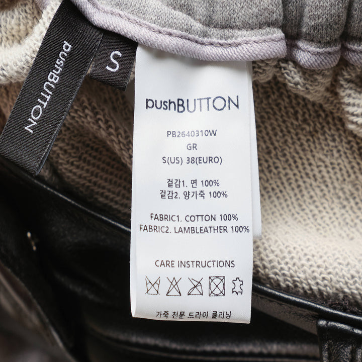 pushBUTTON black faux-leather mini skirt overlay layered over grey marl tapered sweatpants with elasticated cuffs and silver rivet hardware - view 4