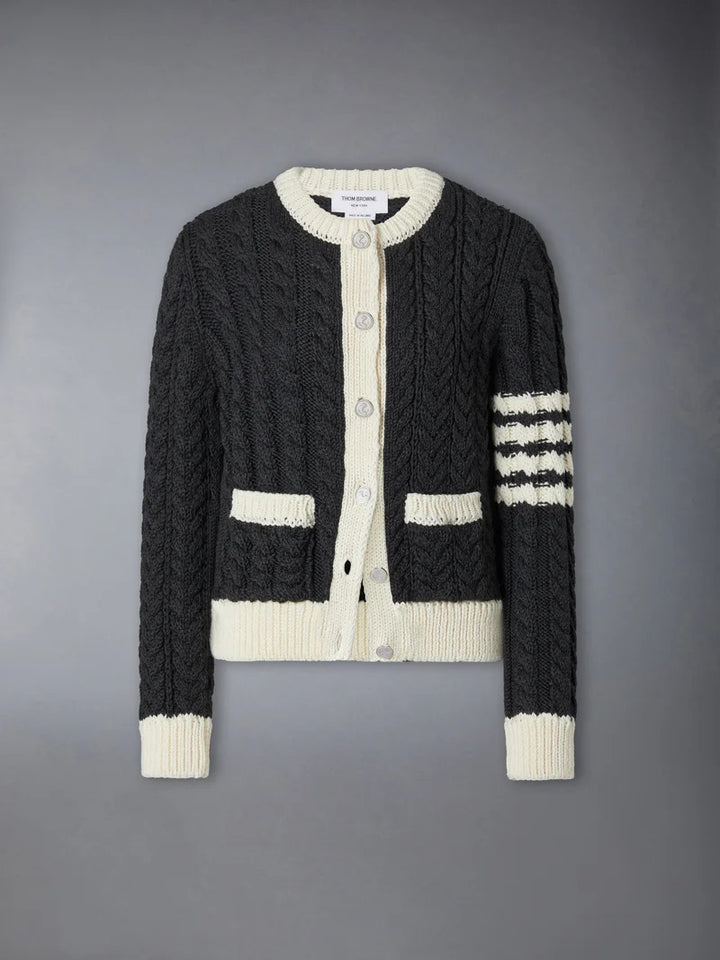 Thom Browne Aran cable-knit crew neck cardigan in charcoal with cream trim, button front, patch pockets and 4-bar stripe on the sleeve
