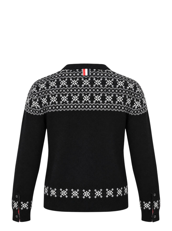 Thom Browne black crewneck cardigan with white and grey snowflake Fair Isle yoke, hem and cuffs, shown front-facing with button-through closure - view 2