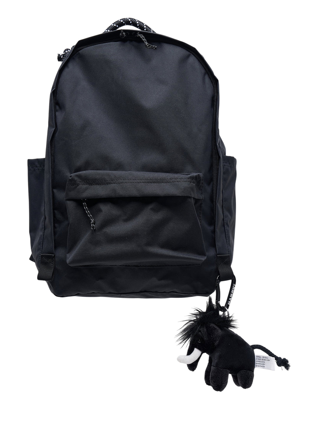Junya Watanabe x Mammut black backpack with front zip pocket and a plush black mammoth charm clipped to the base