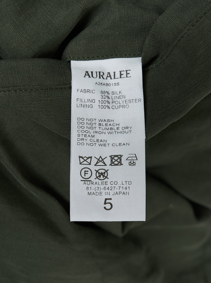 Auralee olive green padded blouson in brushed silk linen satin with four flap pockets, epaulettes and drawstring waist - view 3