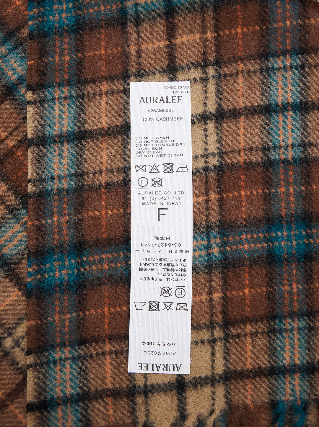 Auralee cashmere long stole in a brown, tan and teal check pattern with twisted fringe ends - view 2