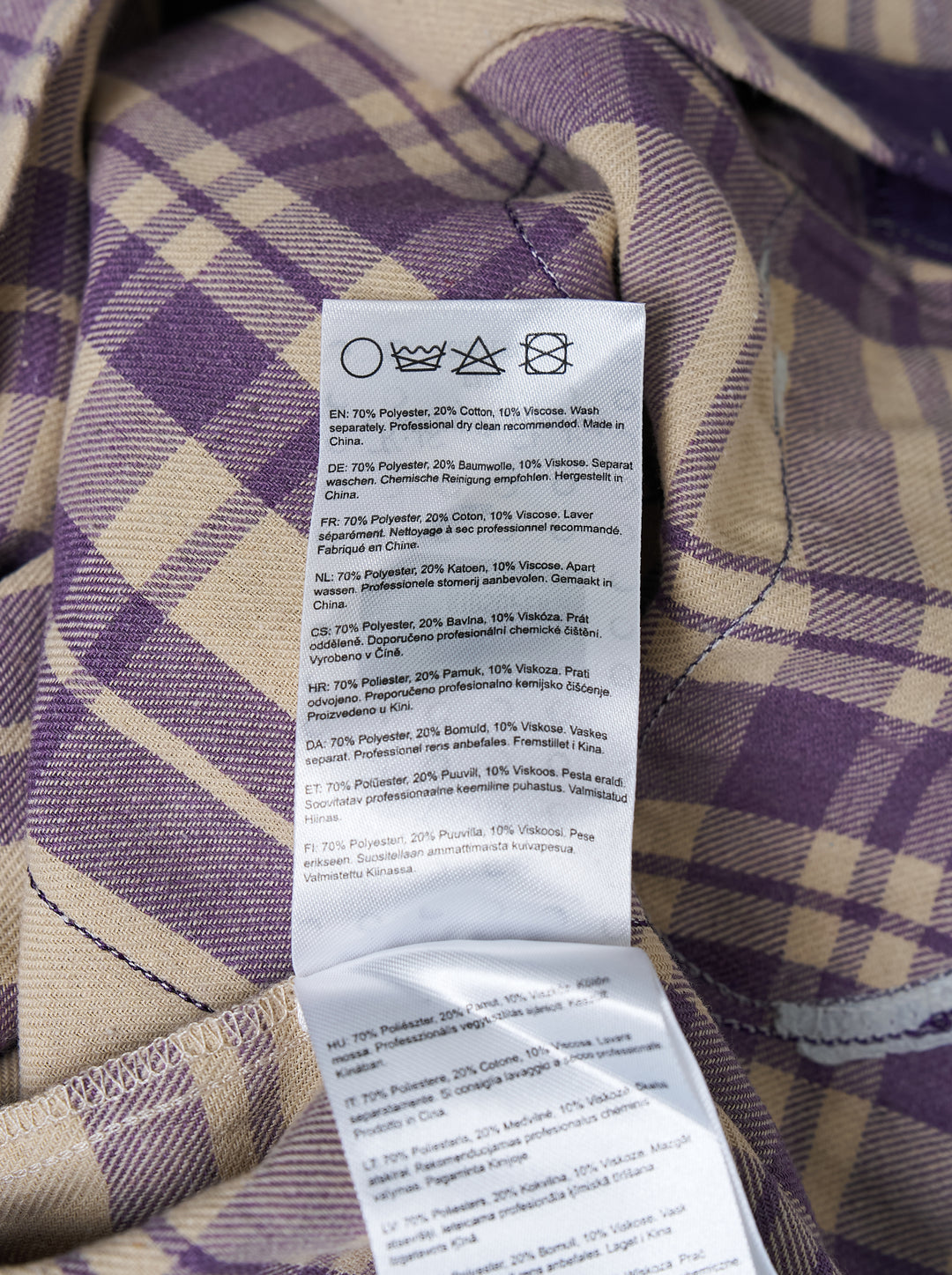 KidSuper Studios Patchwork Face Flannel Shirt in purple and cream plaid with abstract appliqué face panels, shown from the front - view 3