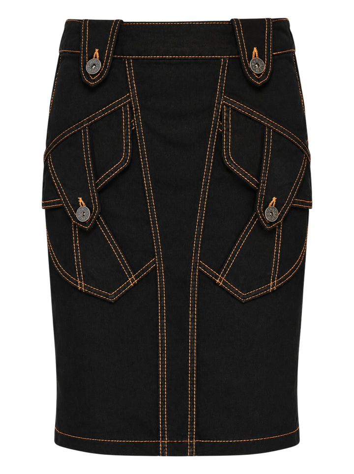 Vaquera black denim pencil skirt with orange contrast topstitching, angular flap pockets and engraved metal buttons, front view