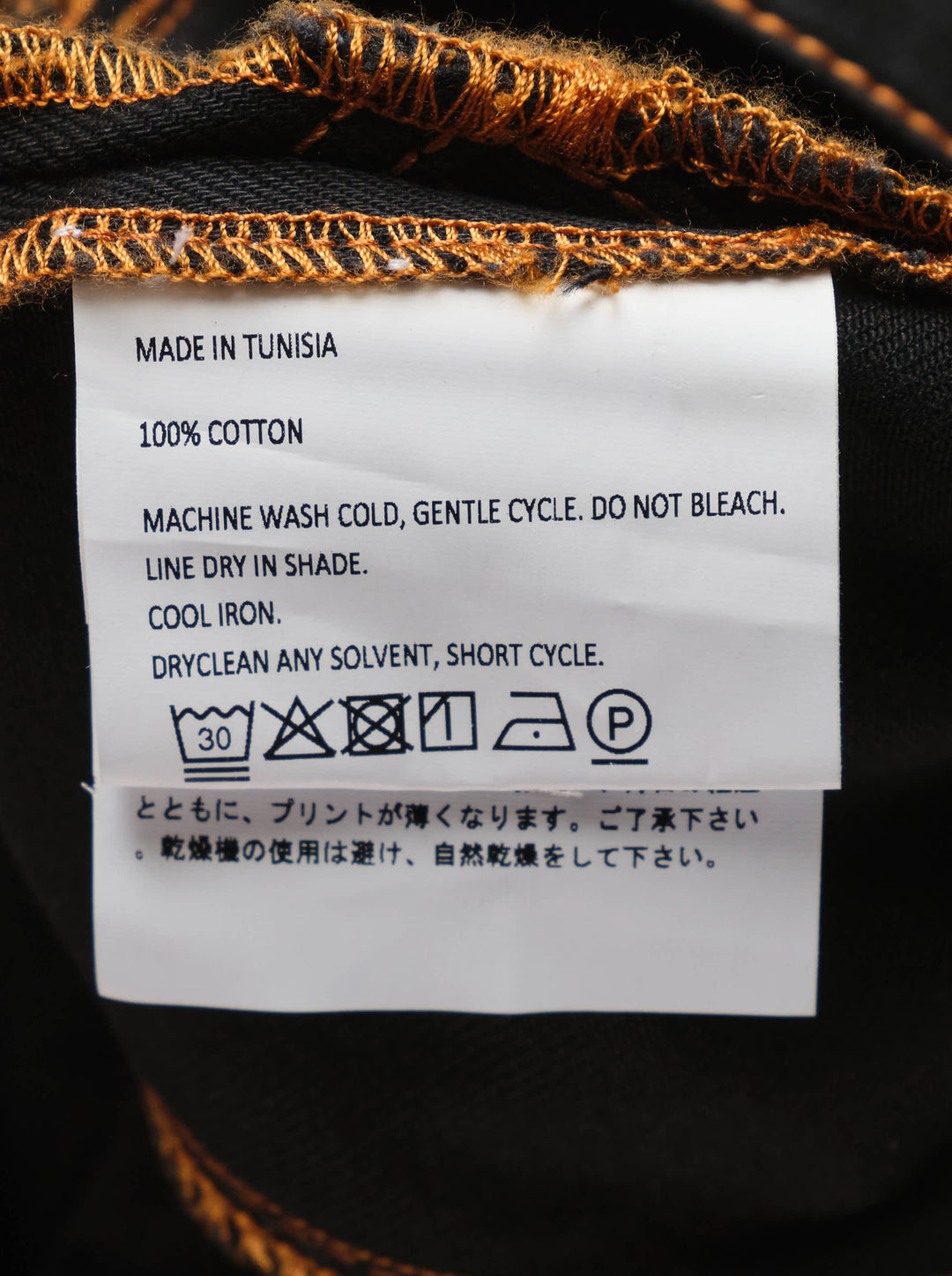 Vaquera black denim pencil skirt with orange contrast topstitching, angular flap pockets and engraved metal buttons, front view - view 3