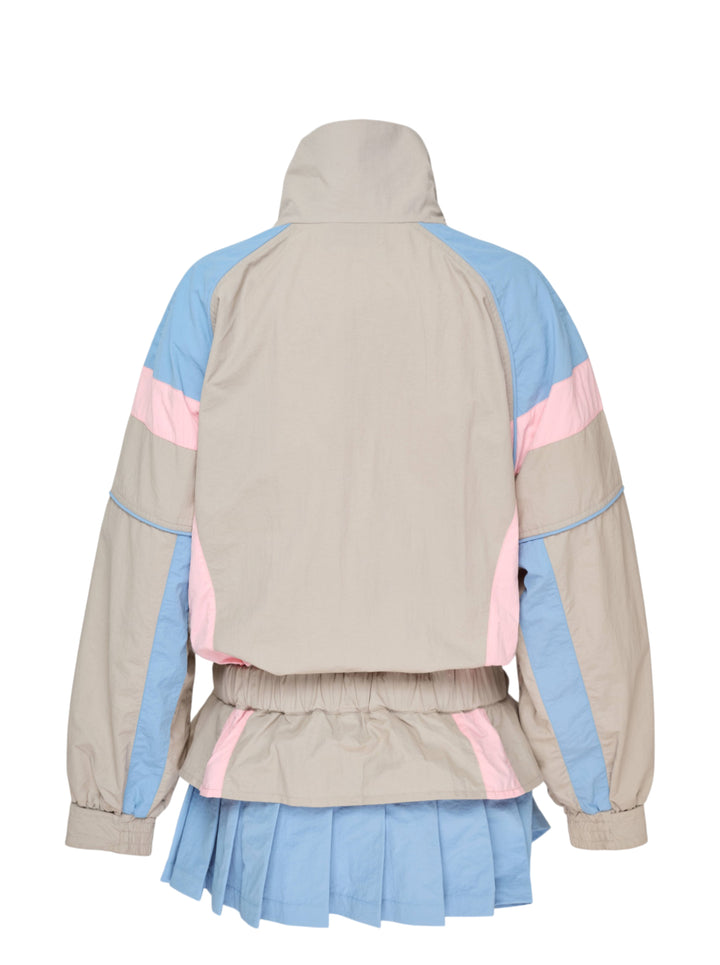 Ashley Williams grey windbreaker dress with sky blue and blush pink colourblock chevron panels, elasticated ruched waist, long sleeves with elasticated cuffs, and a pleated sky blue hem, photographed flat on a white background - view 2
