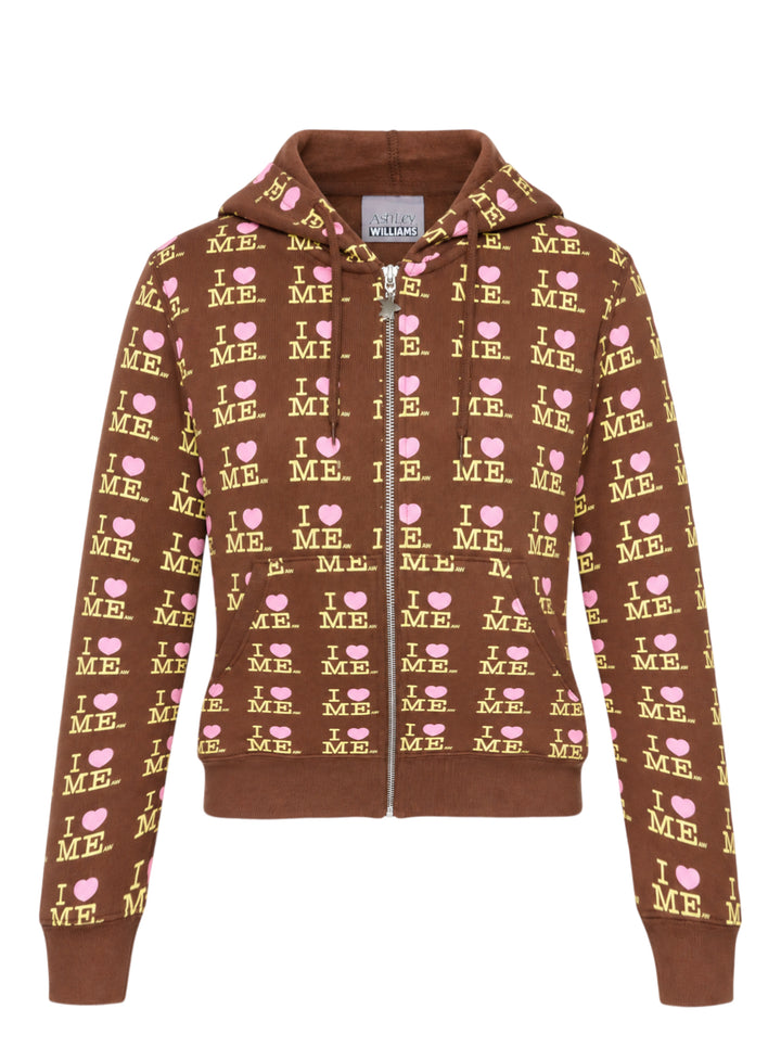 Ashley Williams chocolate brown zip-up hoodie with all-over 'I Heart Me' repeat print in yellow and pink, featuring a star-pull zip, drawstring hood, and cropped silhouette