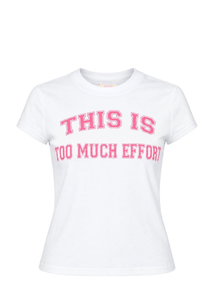 Sultry Virgin white baby tee with bold pink collegiate-style 'This Is Too Much Effort' slogan print on the chest, crew neckline, short sleeves, fitted silhouette