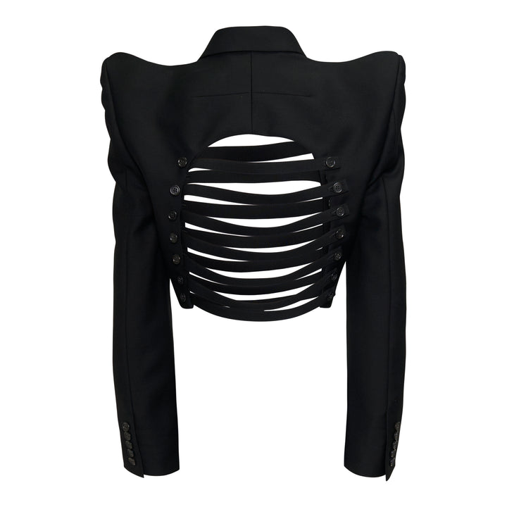 Noir Kei Ninomiya black cropped jacket with horizontal slashed front panels, sculptural shoulders, and double-breasted button detailing, displayed flat on a white background