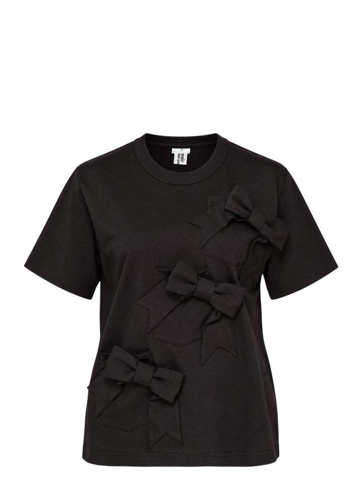 Noir Kei Ninomiya black cotton ponte tee with three dimensional bow appliqués and star-cut panels cascading diagonally down the front