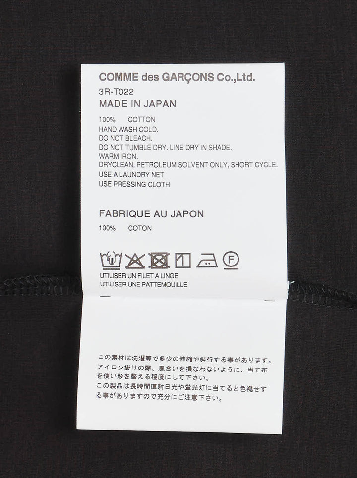 Noir Kei Ninomiya black cotton ponte tee with three dimensional bow appliqués and star-cut panels cascading diagonally down the front - view 3