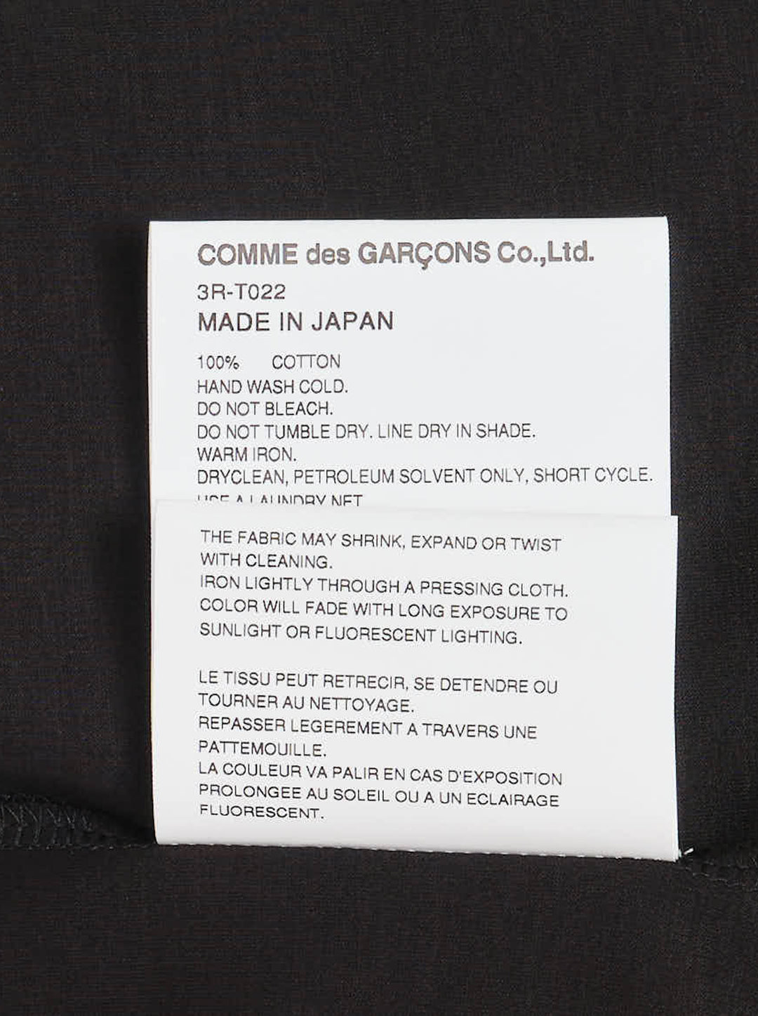 Noir Kei Ninomiya black cotton ponte tee with three dimensional bow appliqués and star-cut panels cascading diagonally down the front - view 4