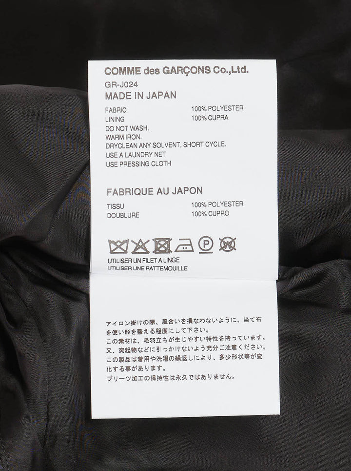 Comme des Garçons deconstructed black floral jacquard jacket with cascading accordion-pleated ruffle panel from collar to hem, shown on white background - view 4