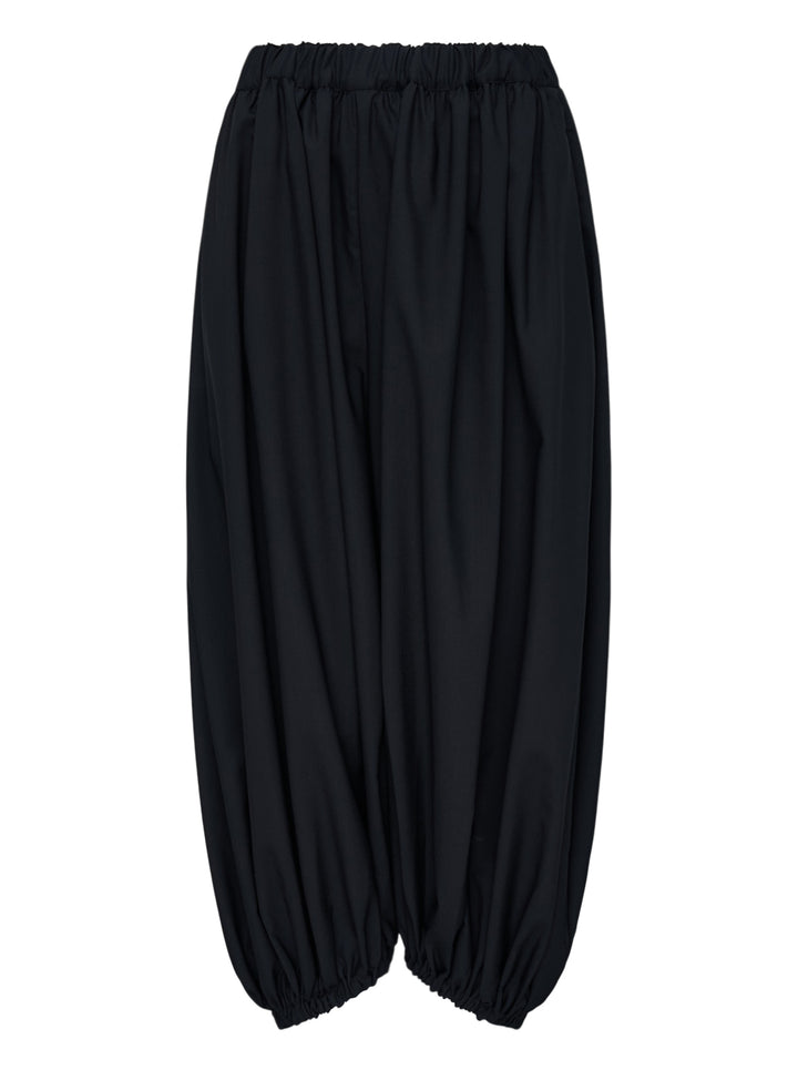 Black balloon pants with an elasticated waist and gathered hems by Comme des Garçons