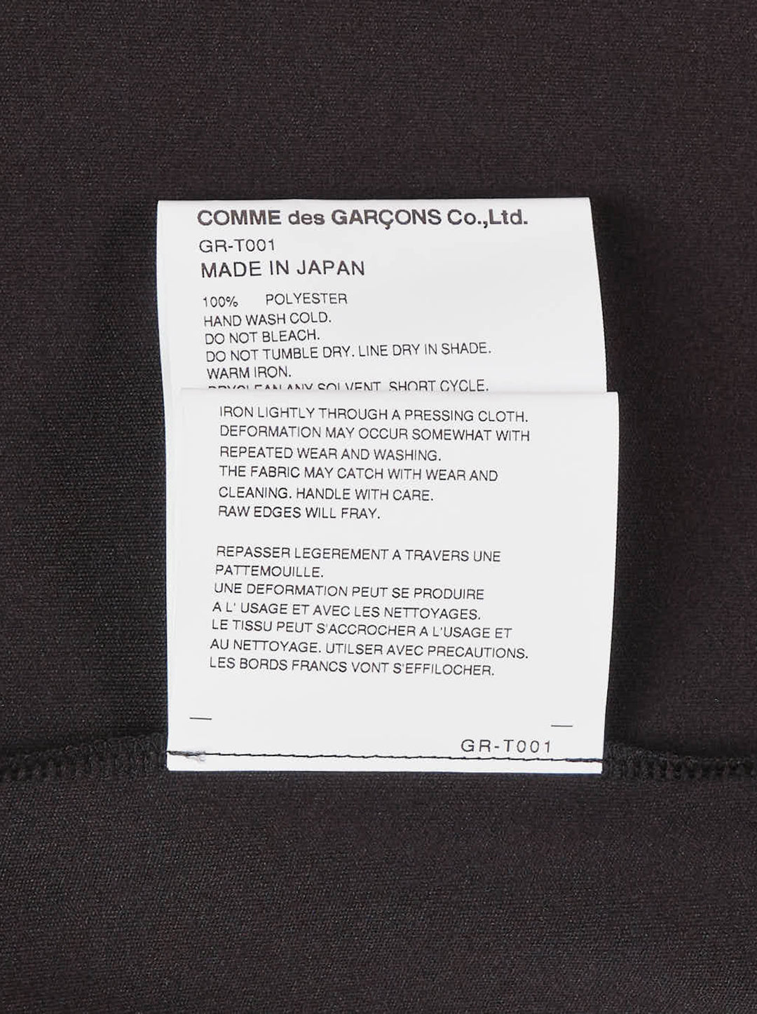 Comme des Garçons black sheer pleated dress with gathered tie neck and layered asymmetric hem, shown from the front - view 4