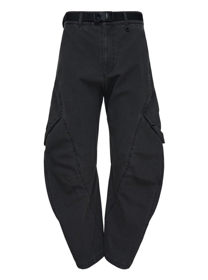 Jiyong Kim washed black multi-pocket cargo trousers with curved wide-leg silhouette, flap pockets and black buckle belt, shown front view
