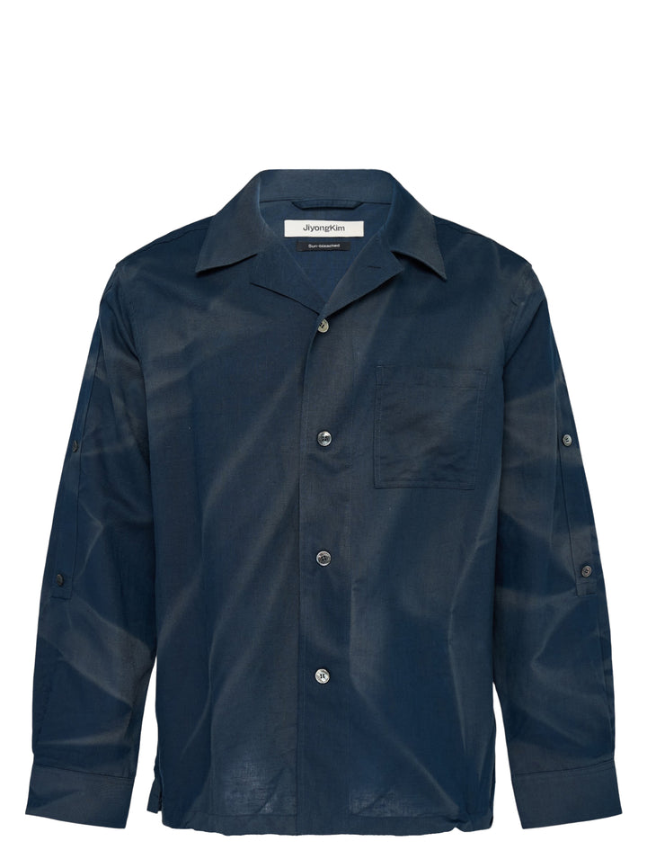 JiyongKim Sun-Bleached Strap Shirt in navy with camp collar, chest pocket and button sleeve straps, shown from the front