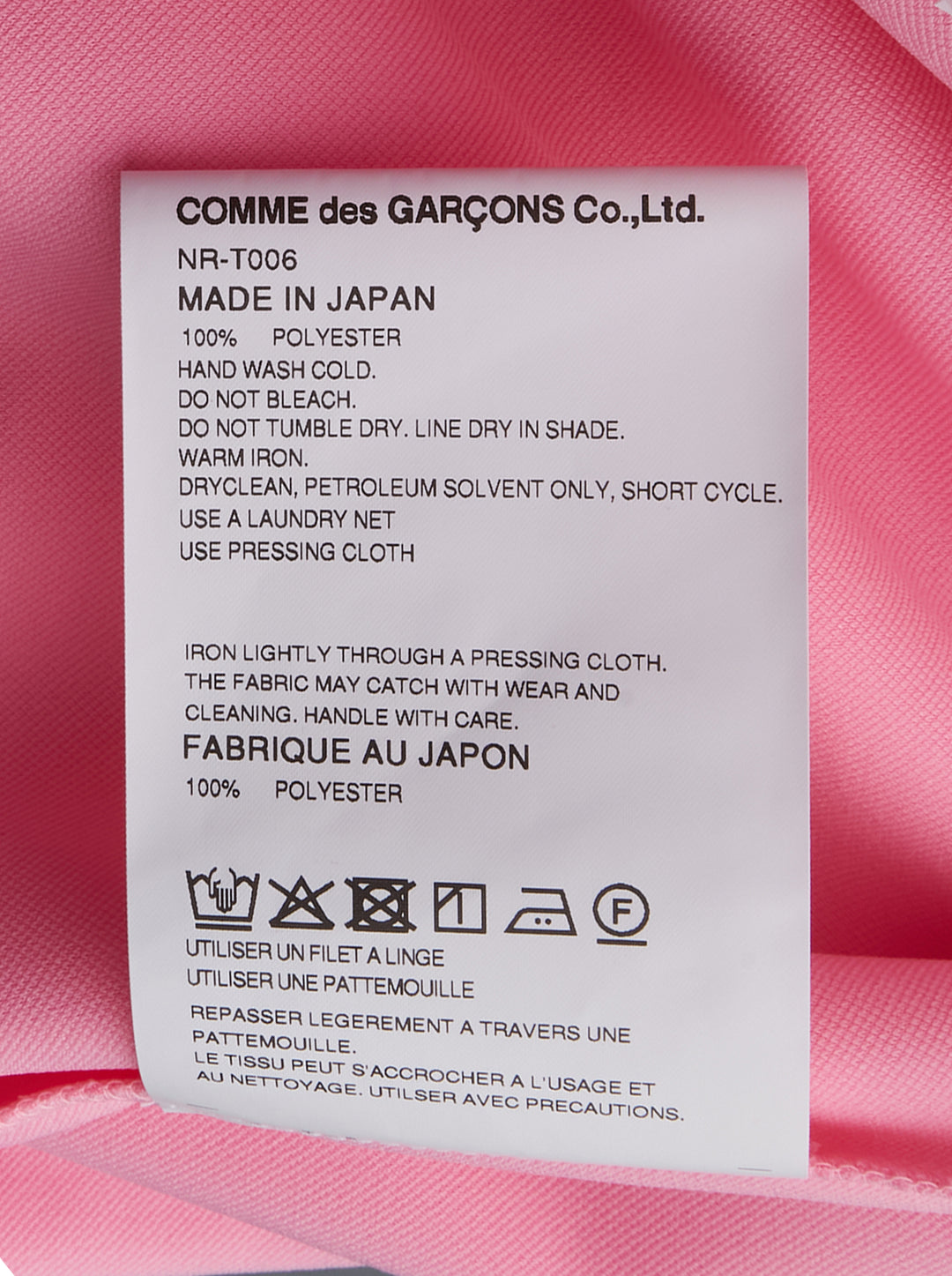 Comme des Garçons Girl pink short sleeve tee with multiple ribbon bows scattered across the chest, relaxed boxy fit with turned-back cuffs and ribbed hem - view 3