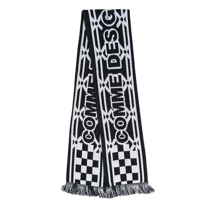 Comme des Garçons Girl holiday knitted acrylic stole with all-over reindeer and tree jacquard motifs in red, pink, and white, with fringe trim at both ends