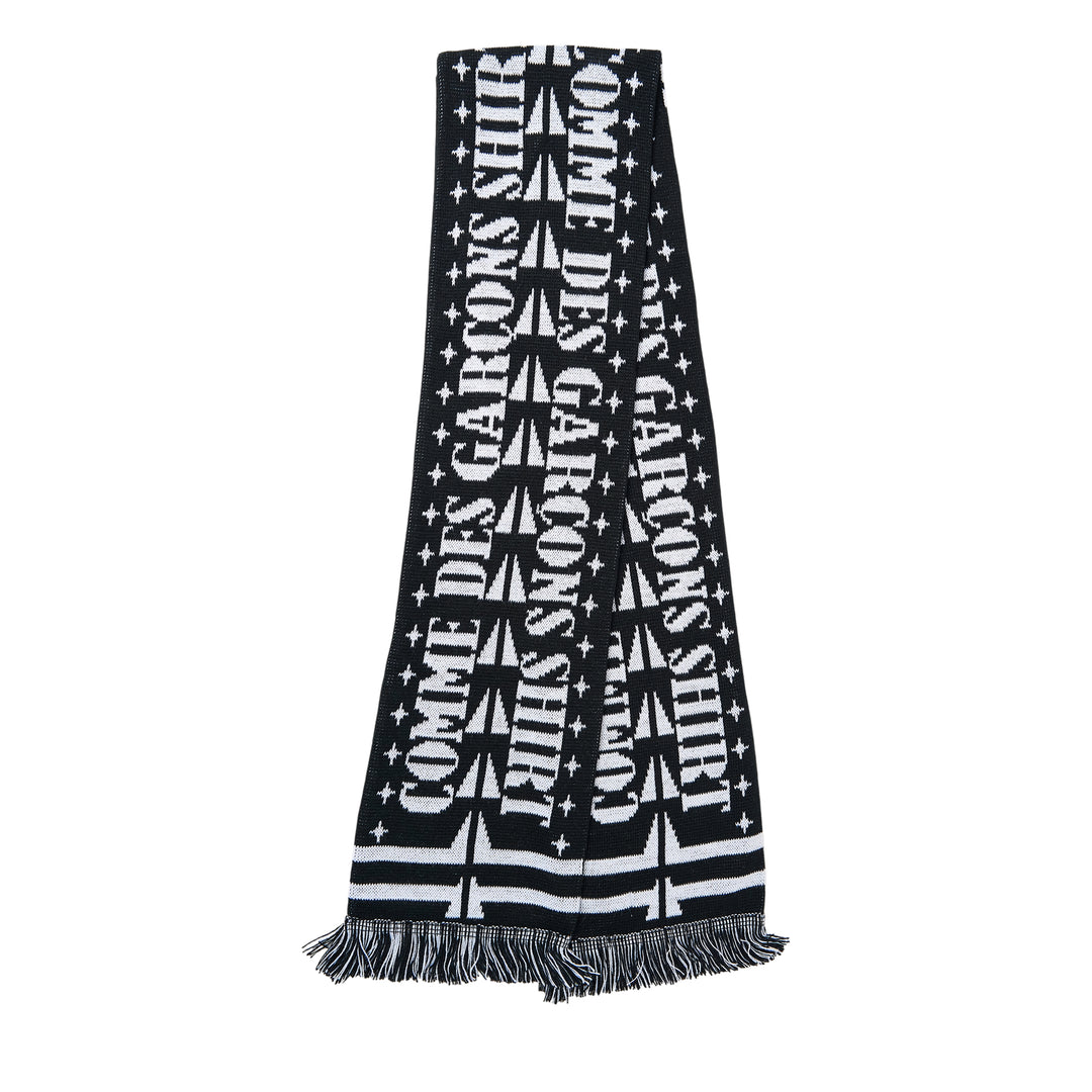 Comme des Garçons Girl knitted acrylic stole in pink gingham with teal snake motifs, red cross and cherry blossom detailing, GIRL logo lettering, and red fringe trim at both ends