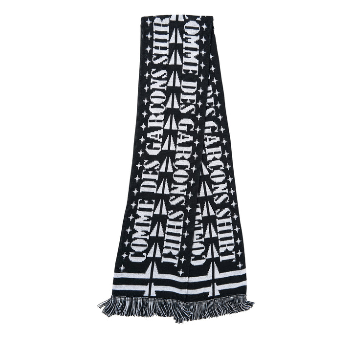 Comme des Garçons Girl knitted acrylic stole in pink gingham with teal snake motifs, red cross and cherry blossom detailing, GIRL logo lettering, and red fringe trim at both ends