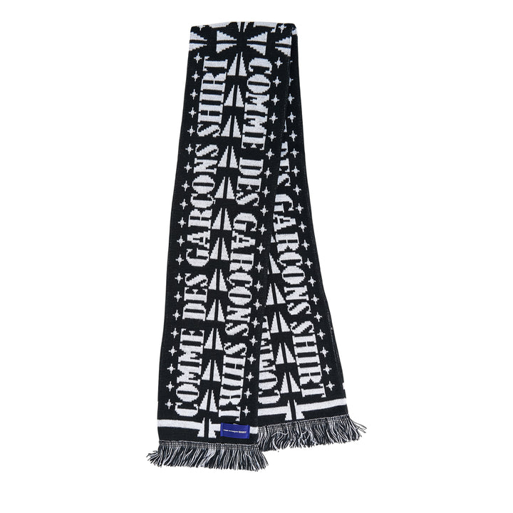 Comme des Garçons Girl knitted acrylic stole in pink gingham with teal snake motifs, red cross and cherry blossom detailing, GIRL logo lettering, and red fringe trim at both ends
