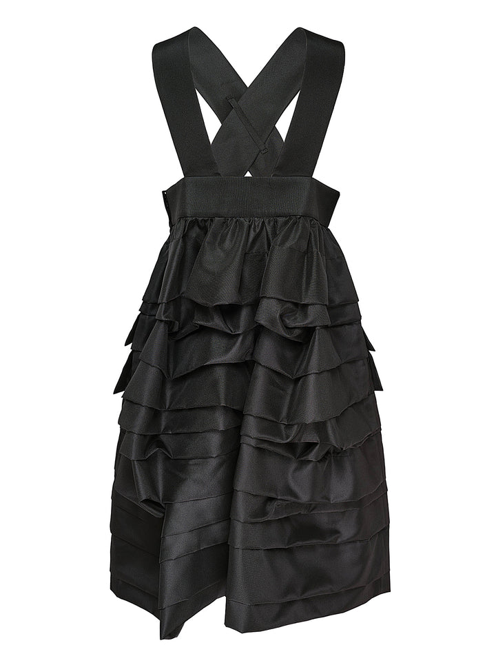 Comme des Garçons Comme des Garçons black crossover pinafore with cascading tiered ruffle skirt and structured waistband, shown from the back against a white background - view 2