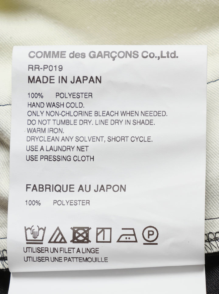 Black wide-leg Comme des Garçons Comme des Garçons pants with an elasticated gathered waist and oversized draped cargo pockets, shown from the front - view 3