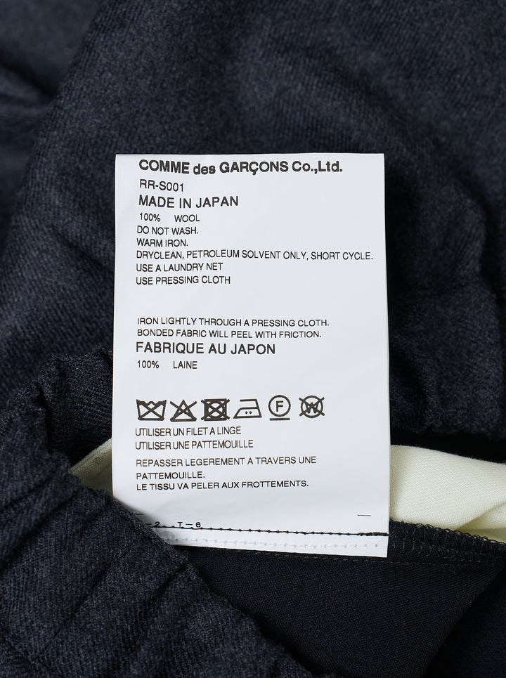 Comme des Garçons Comme des Garçons voluminous cocoon midi skirt in charcoal grey with elasticated drawstring waist and gathered sculptural silhouette, displayed flat on white background - view 3