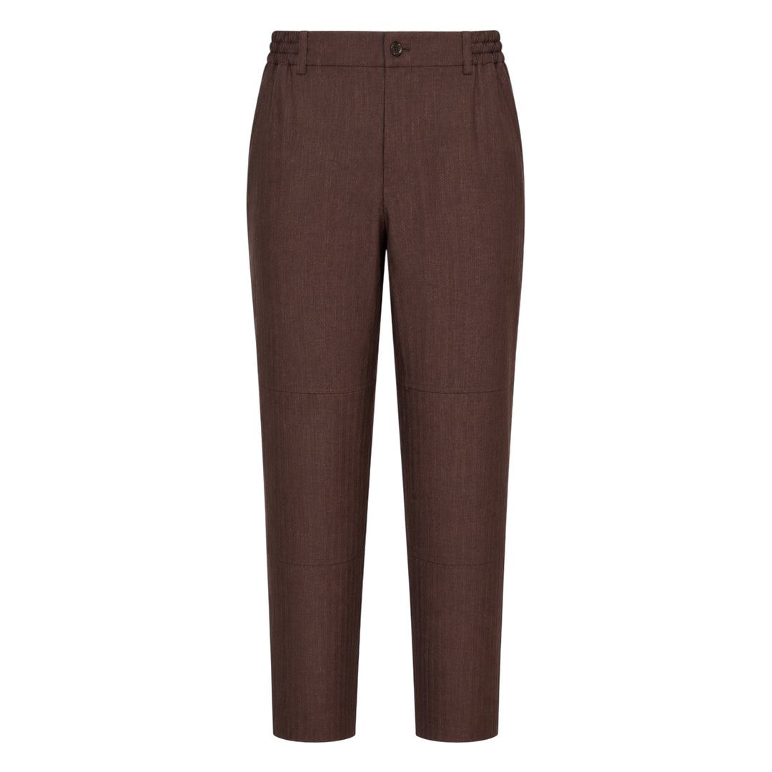 Comme des Garçons Homme Deux wool mini herringbone pants in brown, featuring a tapered leg, elasticated waistband, and panelled knee construction, shown flat on a white background