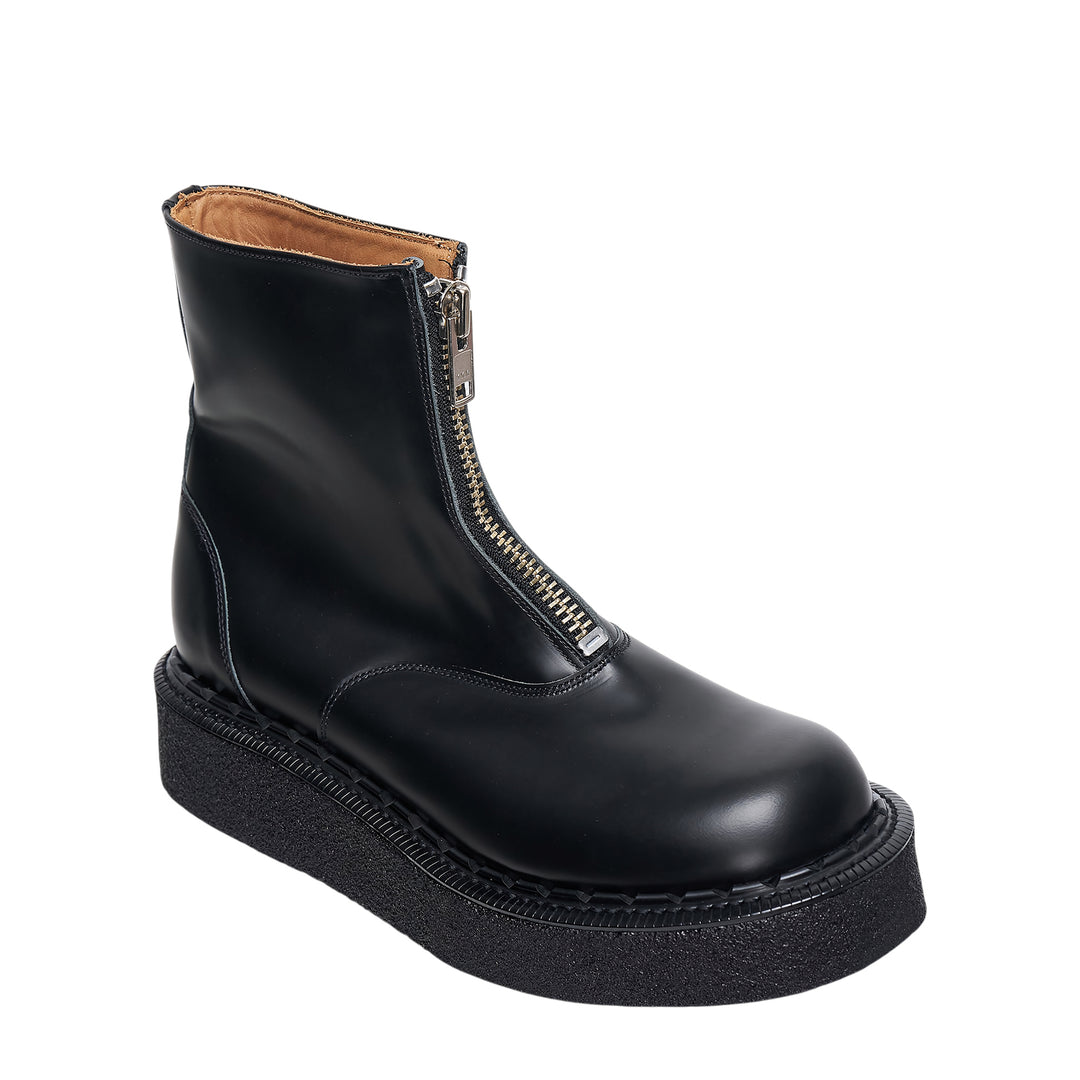 Comme des Garçons Homme Plus x George Cox black polished leather ankle boot with gold-tone front zip closure and chunky black crepe platform sole with white topstitching