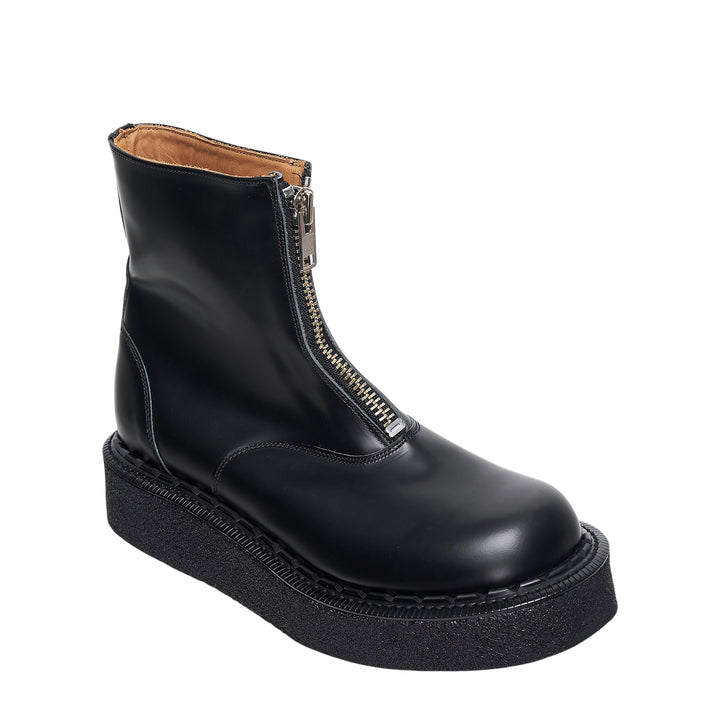 Comme des Garçons Homme Plus x George Cox black polished leather ankle boot with gold-tone front zip closure and chunky black crepe platform sole with white topstitching