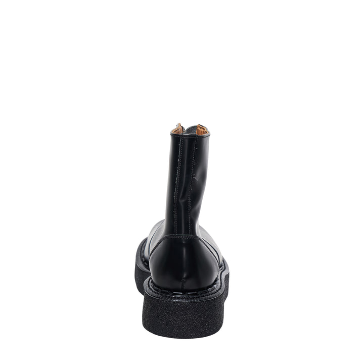 Comme des Garçons Homme Plus x George Cox black polished leather ankle boot with gold-tone front zip closure and chunky black crepe platform sole with white topstitching