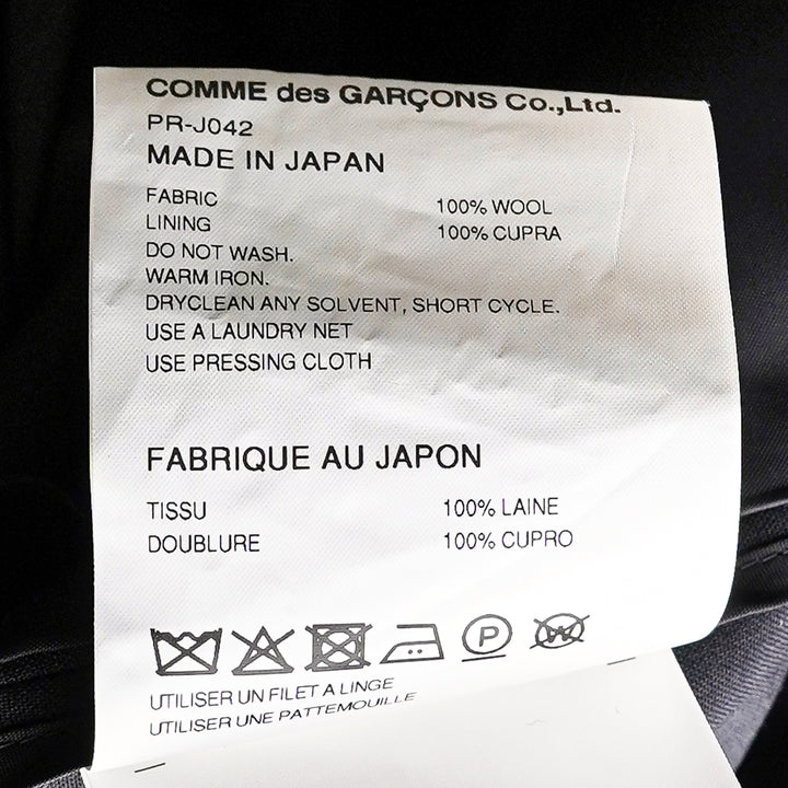 Comme des Garçons Homme Plus black tropical wool single-breasted jacket with gathered fabric loop appliqués across the body and cascading deconstructed strip detailing at the hem, front view on white background - view 3