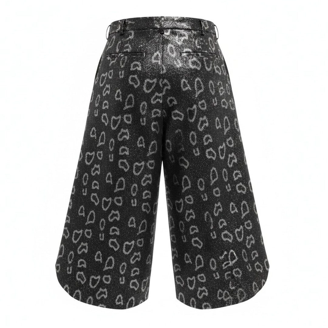 Comme des Garçons Homme Plus wide-leg pants in dark metallic polyester jacquard with an allover open-heart print and dramatically flared curved hem - view 2