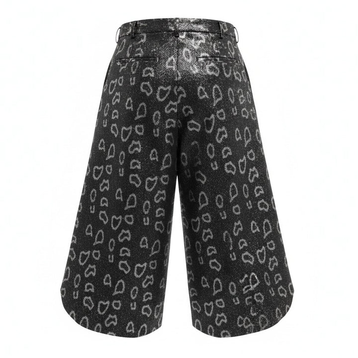 Comme des Garçons Homme Plus wide-leg pants in dark metallic polyester jacquard with an allover open-heart print and dramatically flared curved hem - view 2