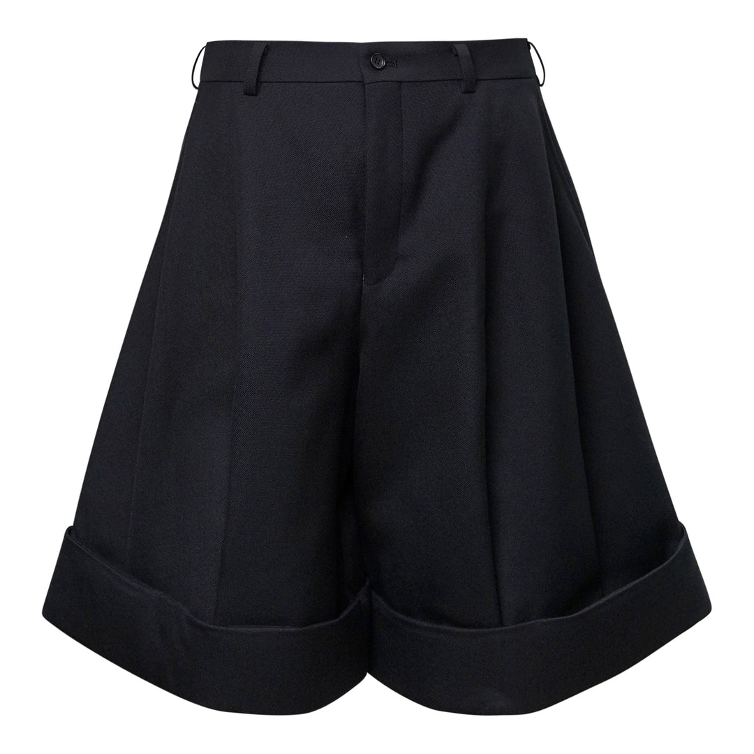 Comme des Garçons Homme Plus black double weave wool wide-leg shorts with deep pleats, button fly, and folded turn-up cuffs, shown flat on white background