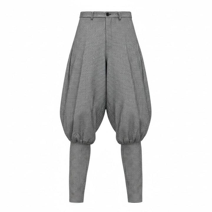 Comme des Garçons Homme Plus wool glen-check balloon pants in monochrome micro-houndstooth, featuring a dramatically voluminous upper leg gathered below the knee and tapering to a slim ankle, shown flat on white background