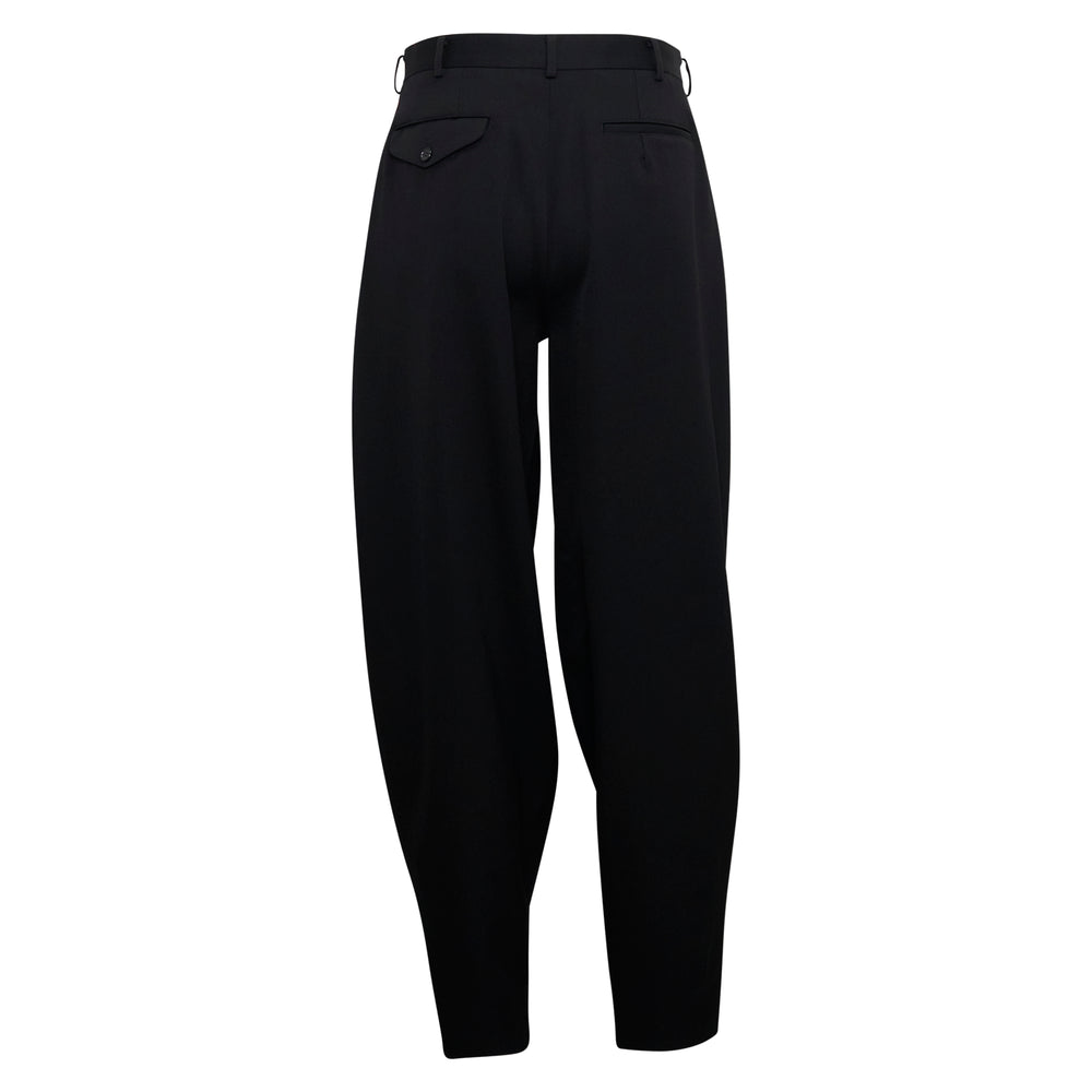 Comme des Garçons Homme Plus black wool double weave gabardine pants with deep front pleats, high waist, and tapered balloon leg silhouette - view 2