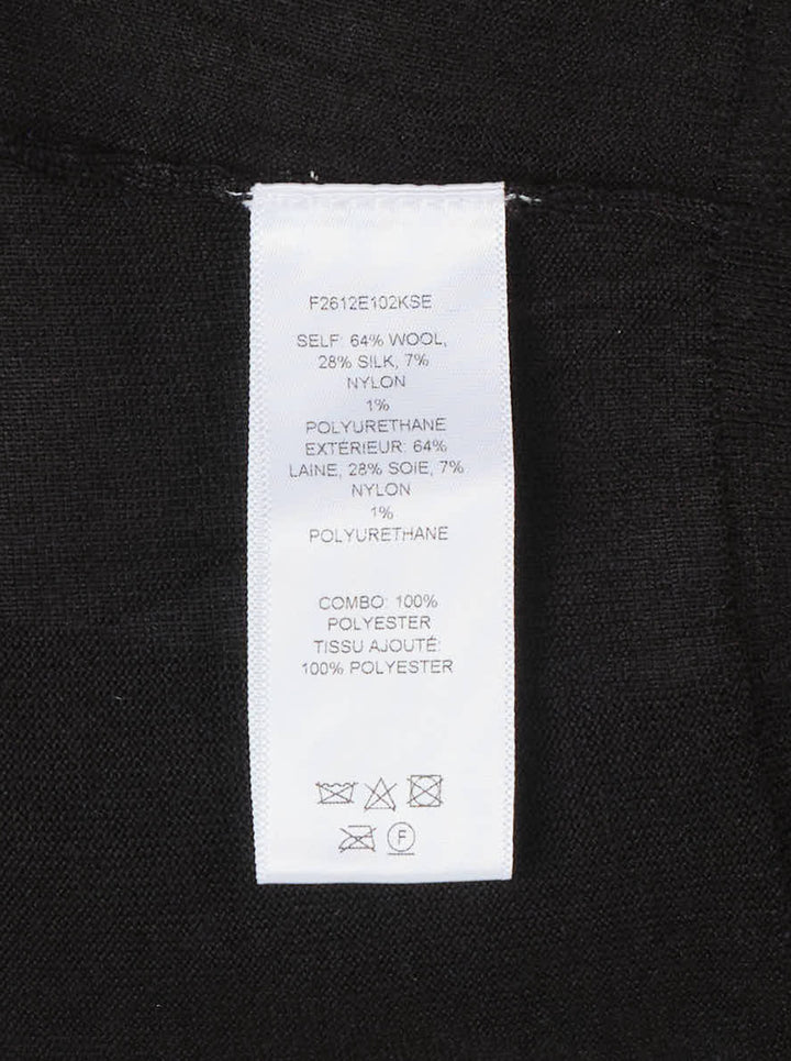 Carolina Herrera black knit cardigan with tonal floral lace centre front panel and covered button fastening, displayed on a flat lay against a white background - view 3