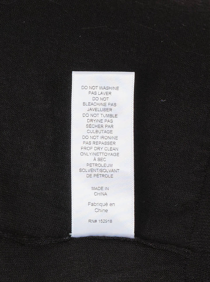 Carolina Herrera black knit cardigan with tonal floral lace centre front panel and covered button fastening, displayed on a flat lay against a white background - view 4