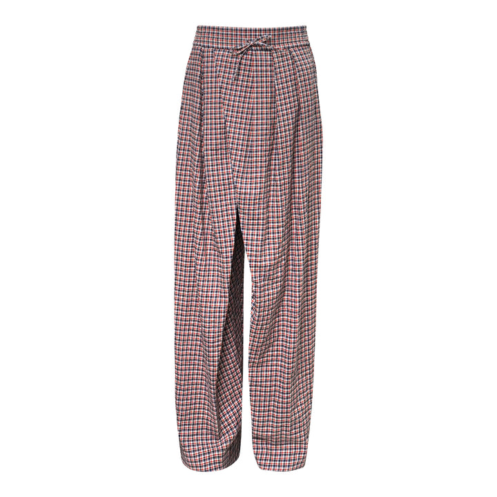 Dries Van Noten loose fit draped front pyjama pants in red, navy and white check plaid with elasticated drawstring waist and wide-leg silhouette