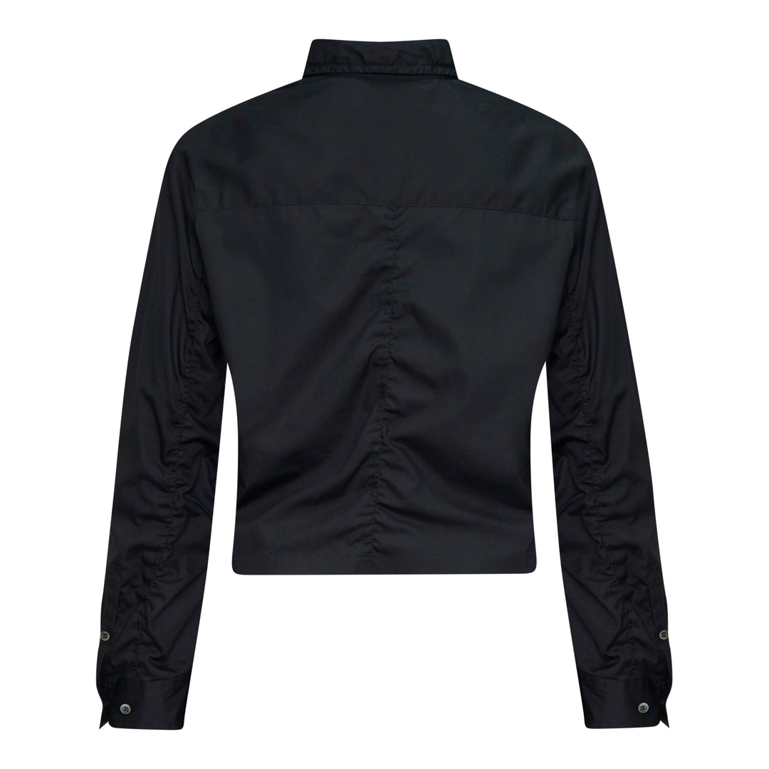 Undercover Cropped U Logo Blouse in black with gathered sleeves, point collar, tonal buttons, and a green embroidered Undercover logo on the chest pocket