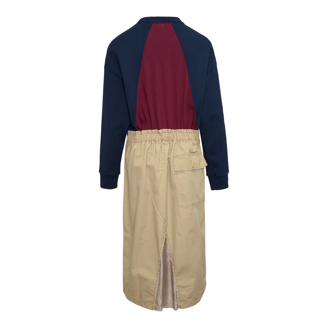 Undercover Trompe L'Oeil Sweater Dress featuring a navy raglan sweatshirt top with small embroidered chest motif over a khaki twill midi skirt with front vent and patch pocket, presented as a single garment