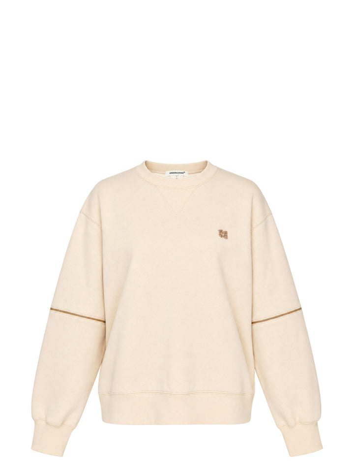 Undercover cream crewneck sweatshirt with zip details across the sleeves and an embellished logo at the chest