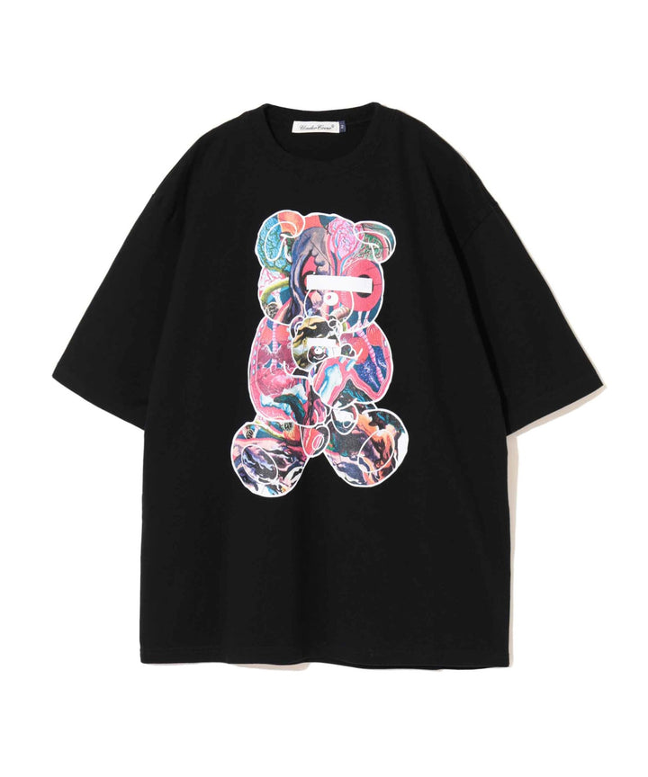 Undercover Bear Print Tee in black, featuring an oversized collage-style multicolour teddy bear graphic on the chest, laid flat on a white background