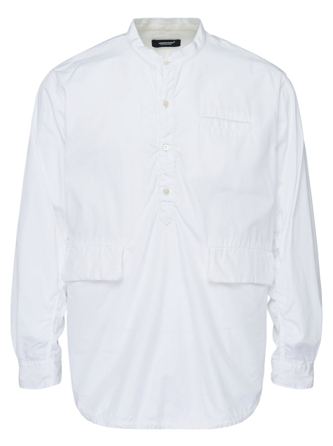 Undercover white long sleeve pullover shirt with band collar, half-button placket, and two flap pockets at the waist