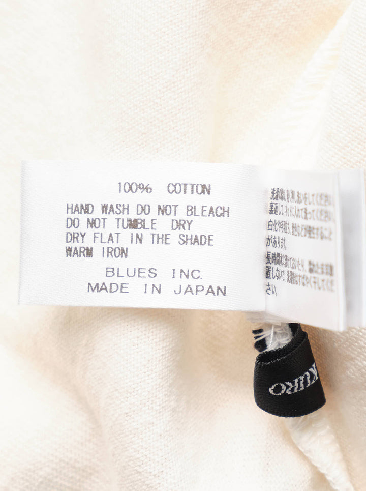 Cream short sleeve Maison Kitsuné x Kuro t-shirt featuring an illustrated fox in blue patchwork denim workwear with Kuro Kitsuné (Paris) text - view 3