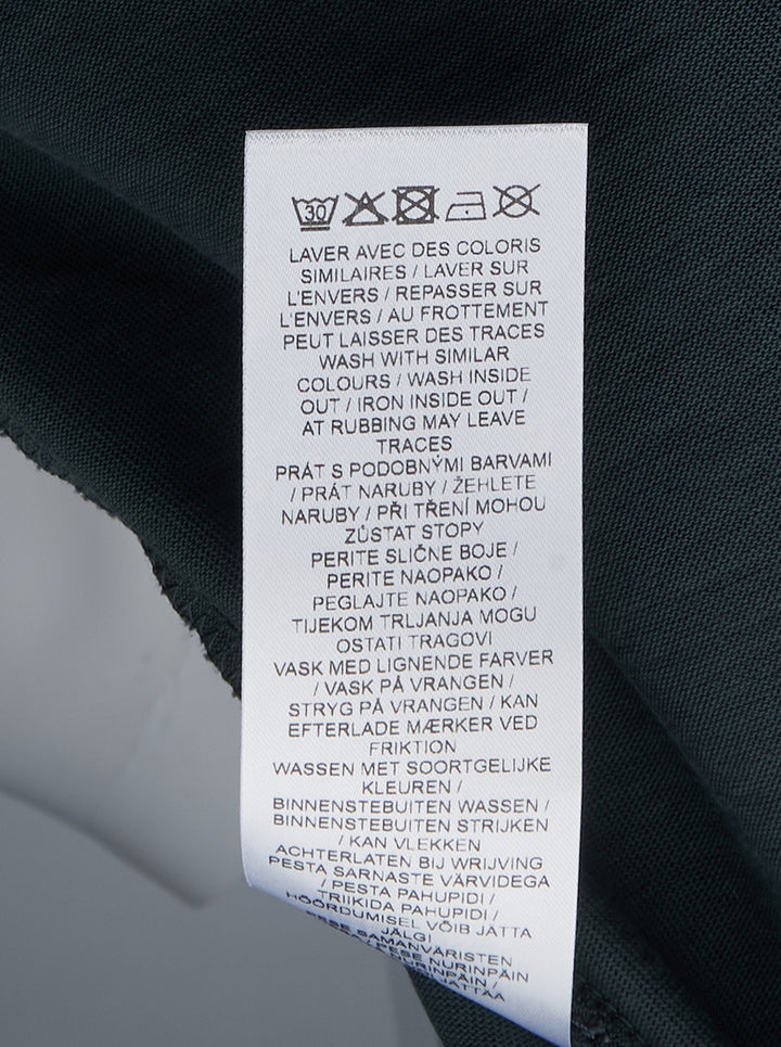 Maison Kitsuné Handwriting Short Sleeve Tee in washed slate blue with embroidered script logo at the chest, shown front-facing on a plain white background - view 3