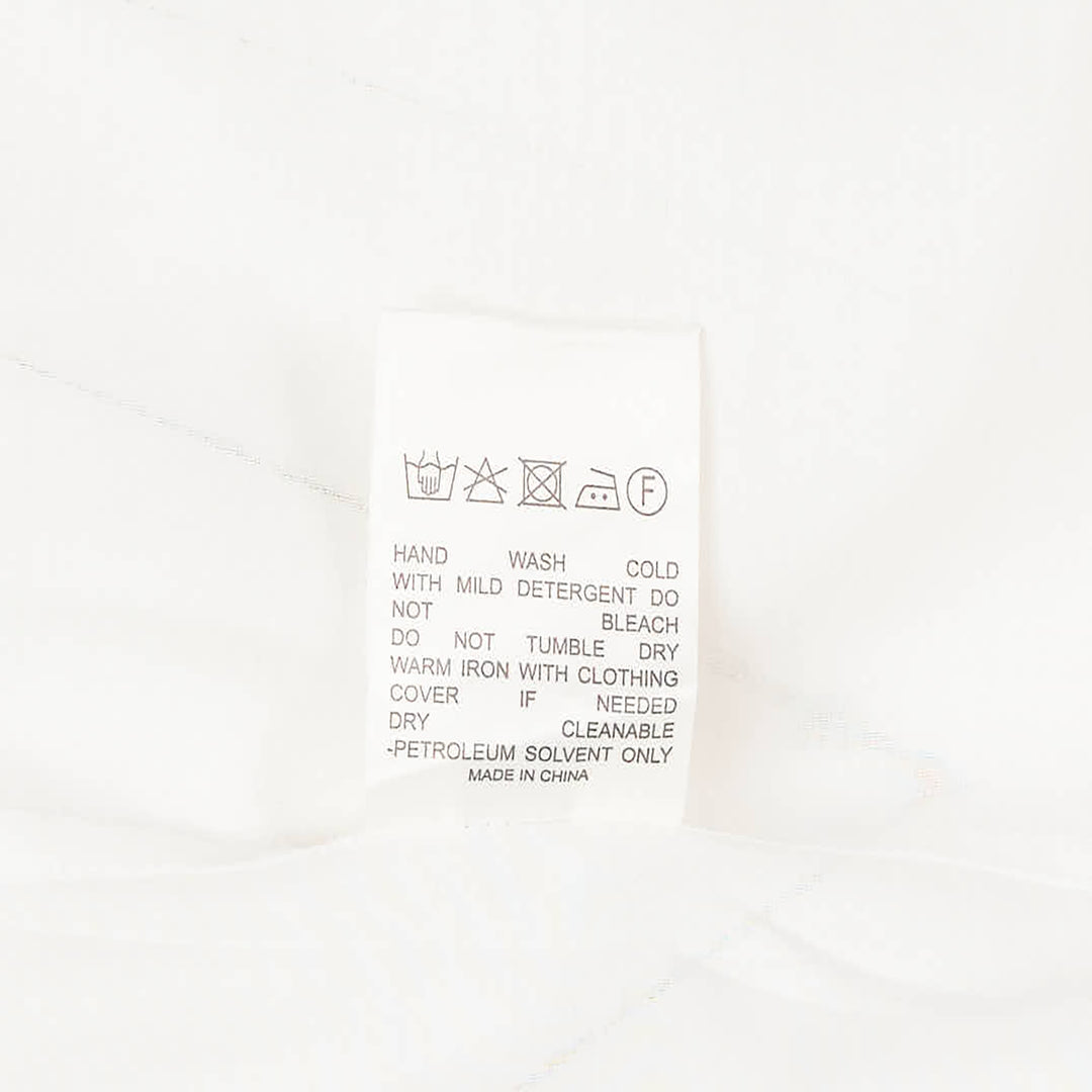 Club21 Collection sheer black long-sleeve button-up blouse with draped gathered collar and wide contrast cuffs, displayed flat on a white background